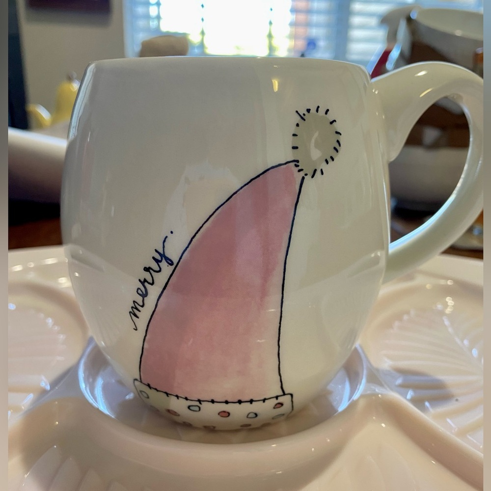 Christmas Mug by Magenta. Pink Santa Hat w/Merry on side. Back Add’l writing.EUC